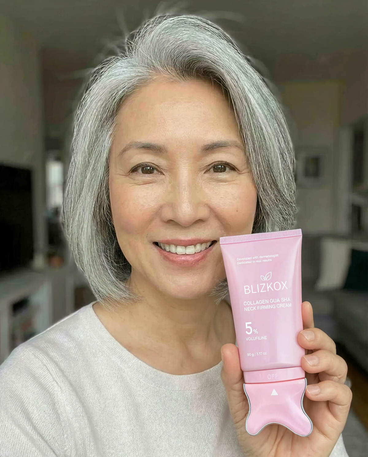 Jennifer holding Aeterna skincare cream