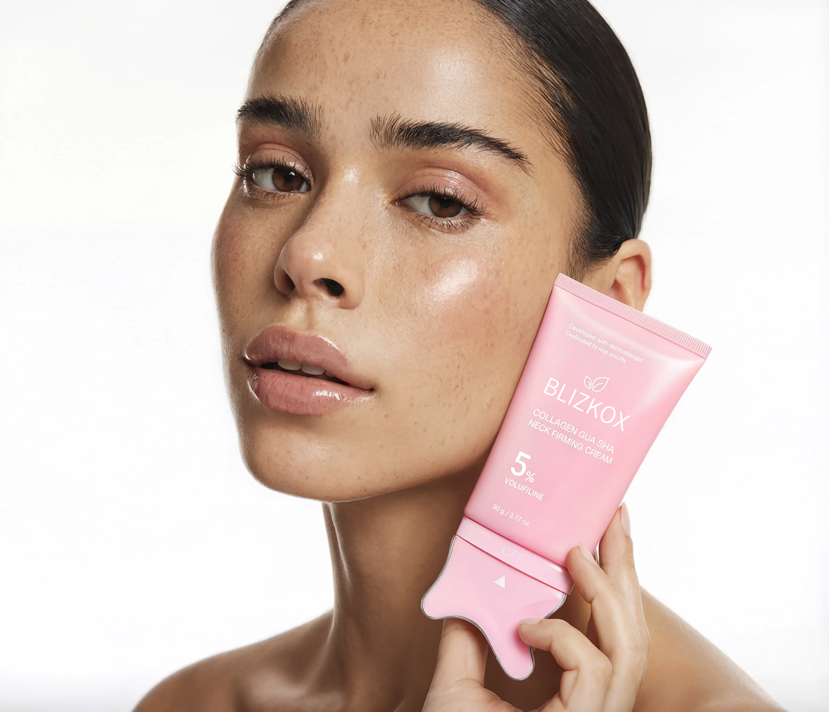 Woman holding Aeterna collagen Gua Sha cream